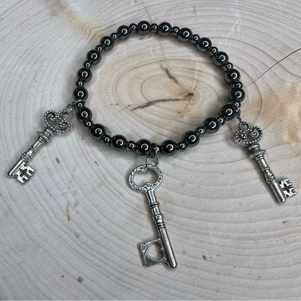 Hand crafted Hematite bracelet with three skeleton key charms 6 mm 7”